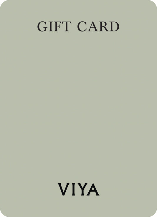 The image depicts a gift card with a minimalistic design featuring a plain, light background and large, black serif text that reads "GIFT CARD" at the top and "VIYA" at the bottom. The design is simple and elegant, with no additional motifs or patterns visible.