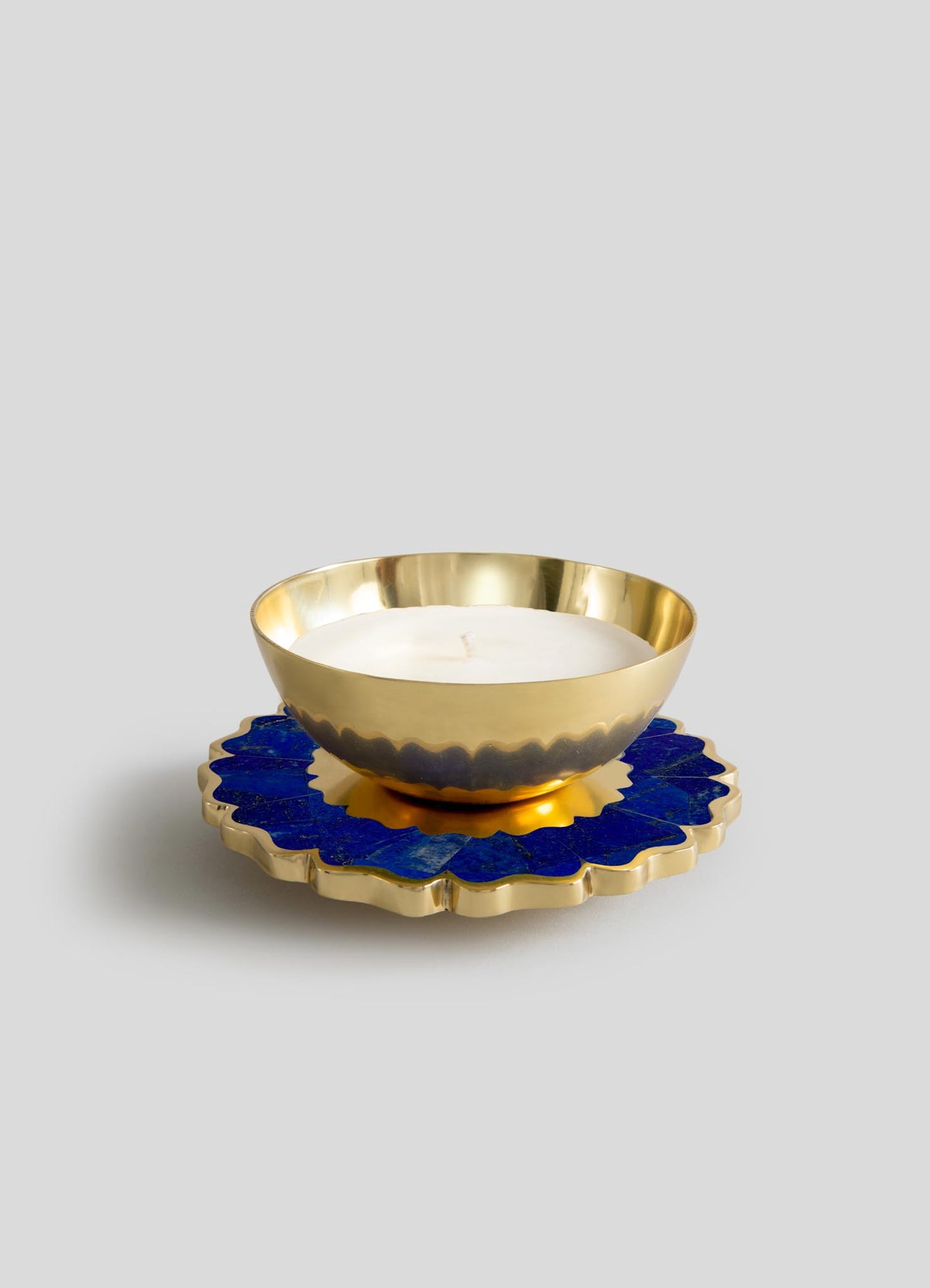 The Viya Mystical Marigold Blue Scented Candle Diya Large features a gold-toned, scalloped bowl on a round base with bright blue and gold floral patterns, displayed against a plain light gray background.