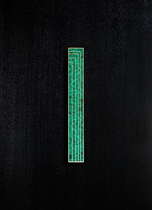 A decorative wall panel featuring a vertical design with a combination of green marble-like patterns and gold trim, set against a black textured background.