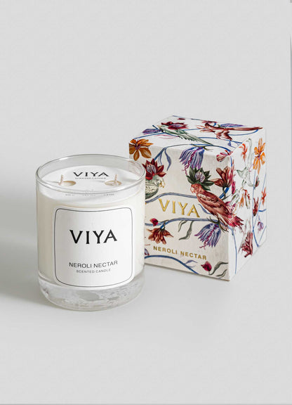 VIYA candle and its packaging on a light gray background viya luxury wax candle stand
