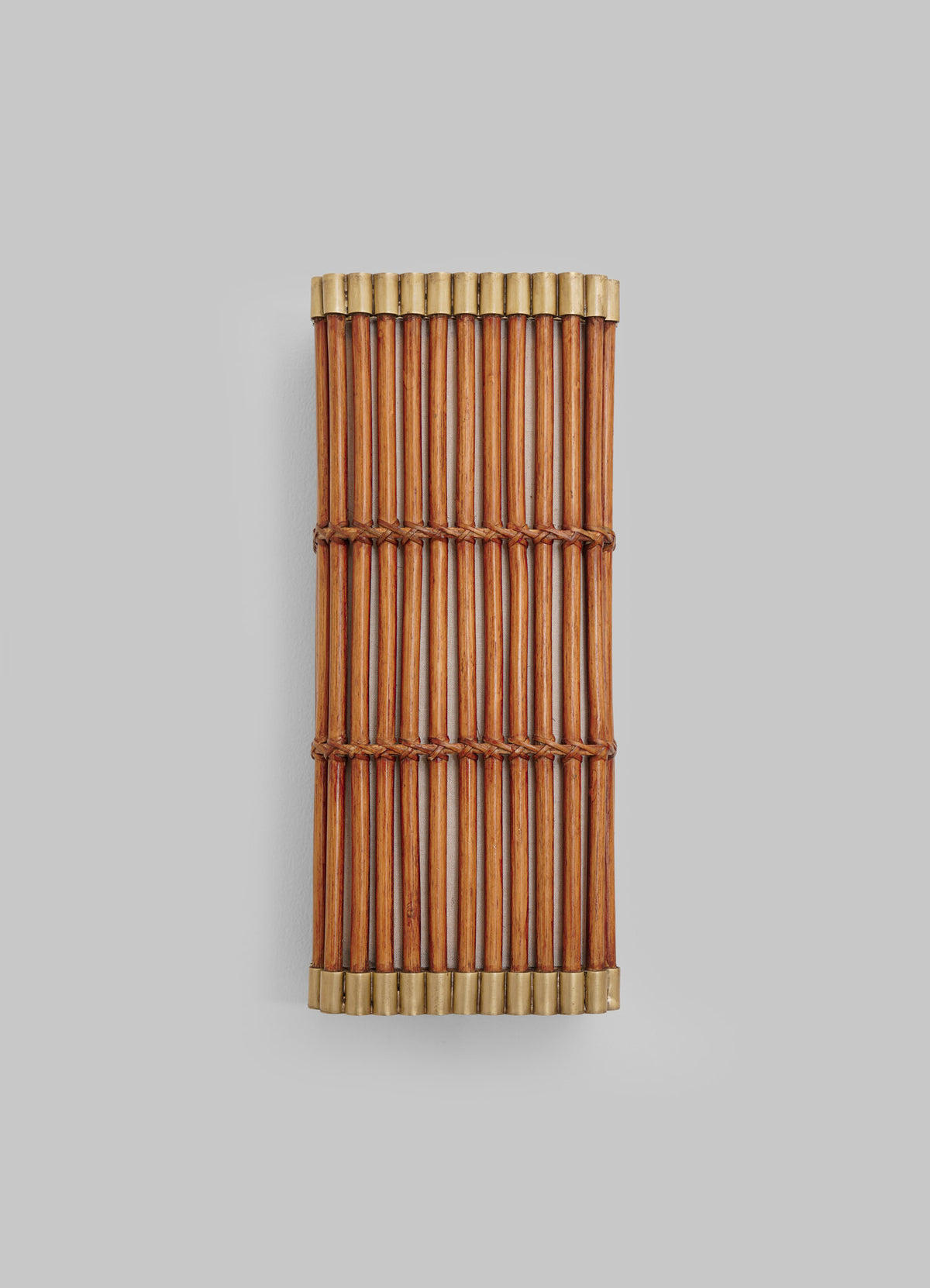 A rectangular Namsai Wall Sconce by VIYA, crafted using traditional Indian techniques with parallel bamboo sticks tied together by brown string, is capped at both ends with light-colored bands and displayed on a plain gray background.