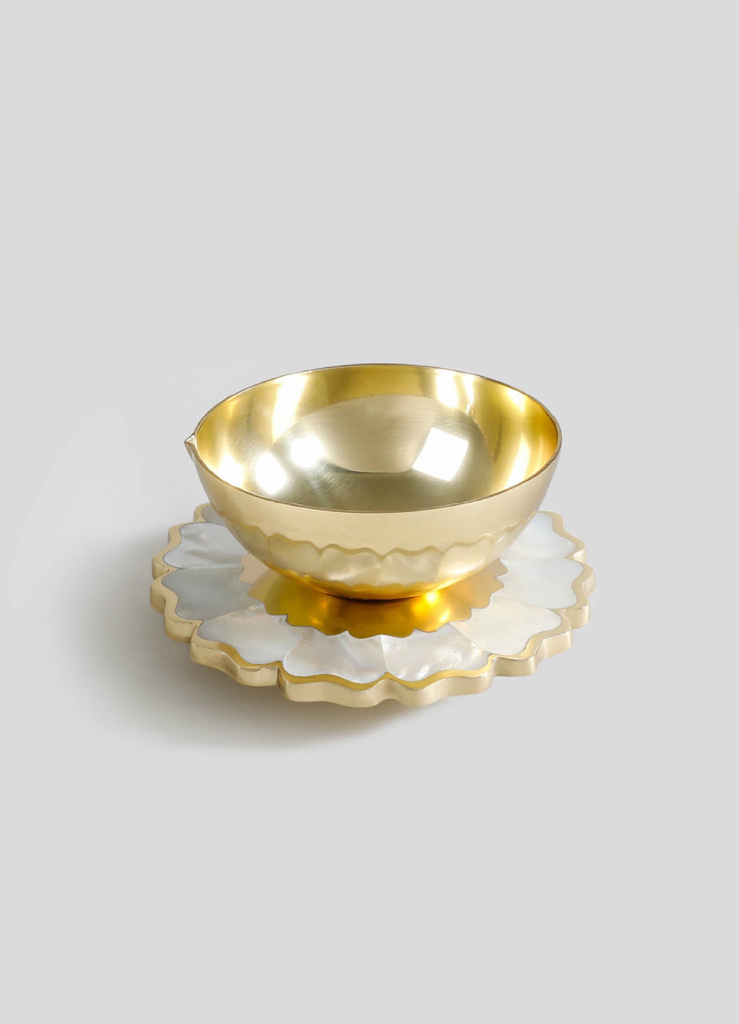 brass diyas white