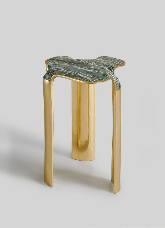 Stool with gold legs and green marble top on a light gray background