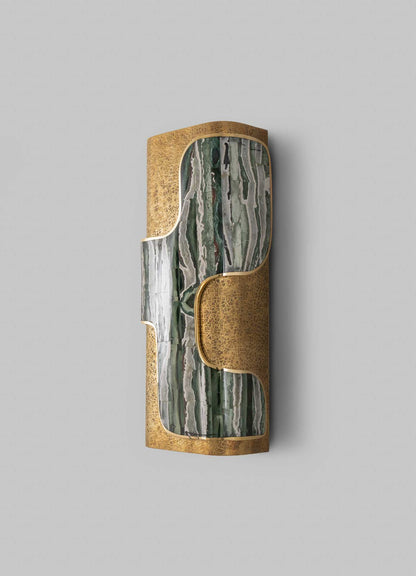 A decorative wall-mounted sculpture with a combination of polished green and gray marble and textured brass detailing, featuring organic curved shapes and a cylindrical form.