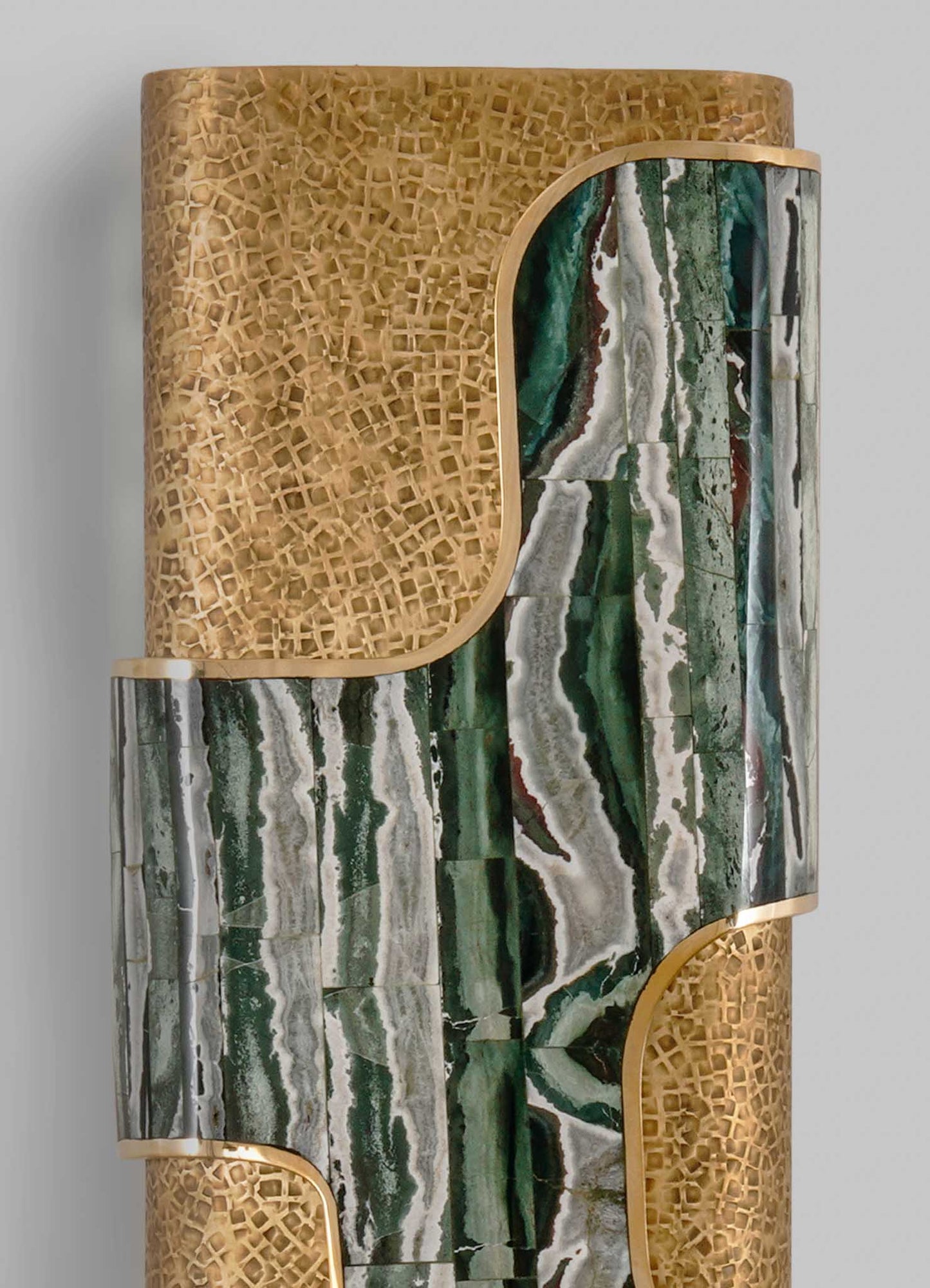 A decorative cabinet featuring a combination of green, white, and brown marble with bold natural veining, accented by gold-colored metal edges and a honeycomb-patterned wooden panel on top. The style is modern with luxurious details and organic motifs.