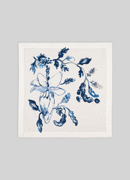 White towel with blue floral design on a gray background