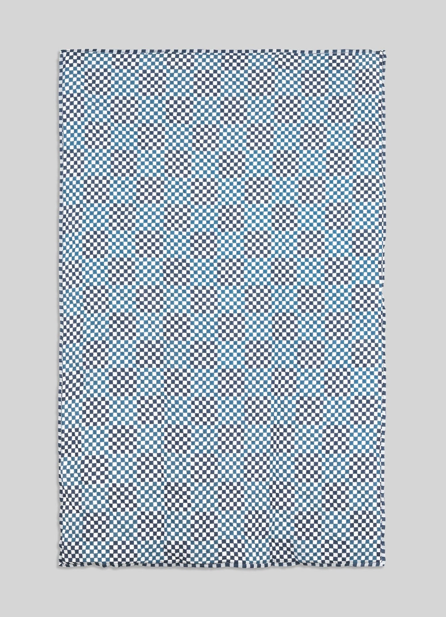 Checkered patterned fabric on a gray background viya