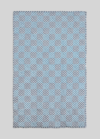 Checkered patterned fabric on a gray background viya