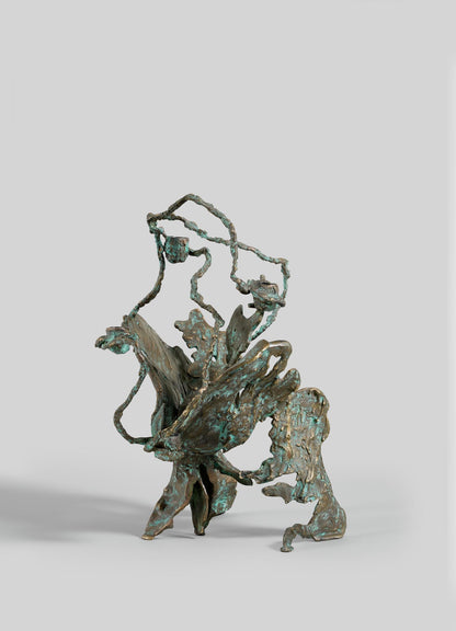 The VIYA Butterfly Candle Stand Large features an abstract bronze design with twisting, branch-like forms, a patina finish, and textured surfaces, presented against a plain gray background.