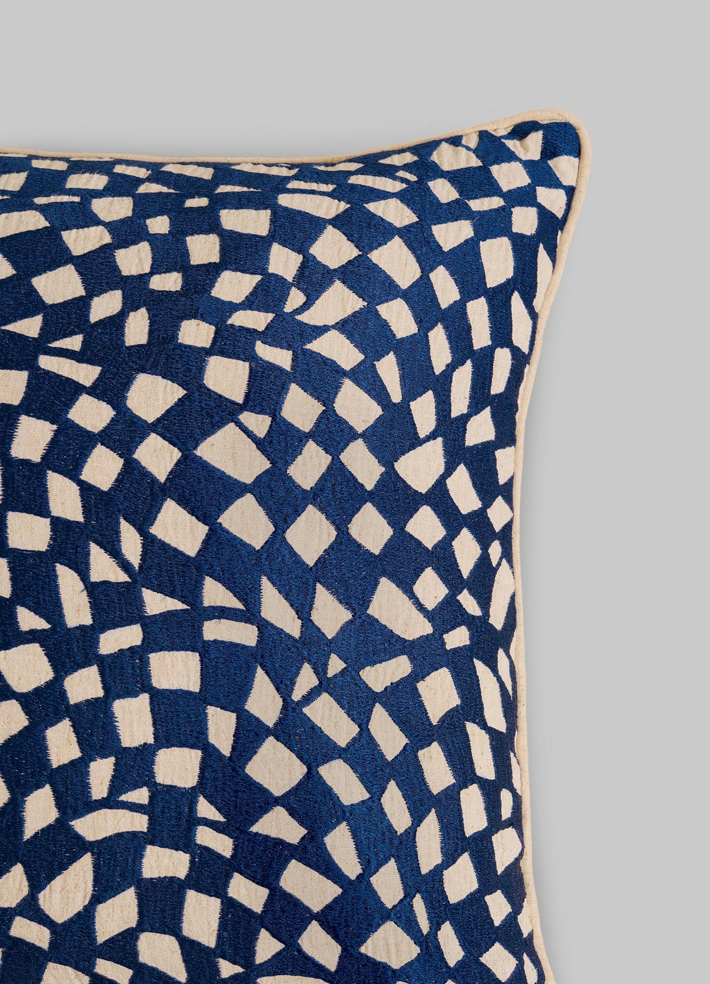 The Viya Dreamscape Blue Embroidered Checks Cushion Cover 18"x18" features an abstract cream geometric pattern on navy, seen in the upper left against a plain light gray background.