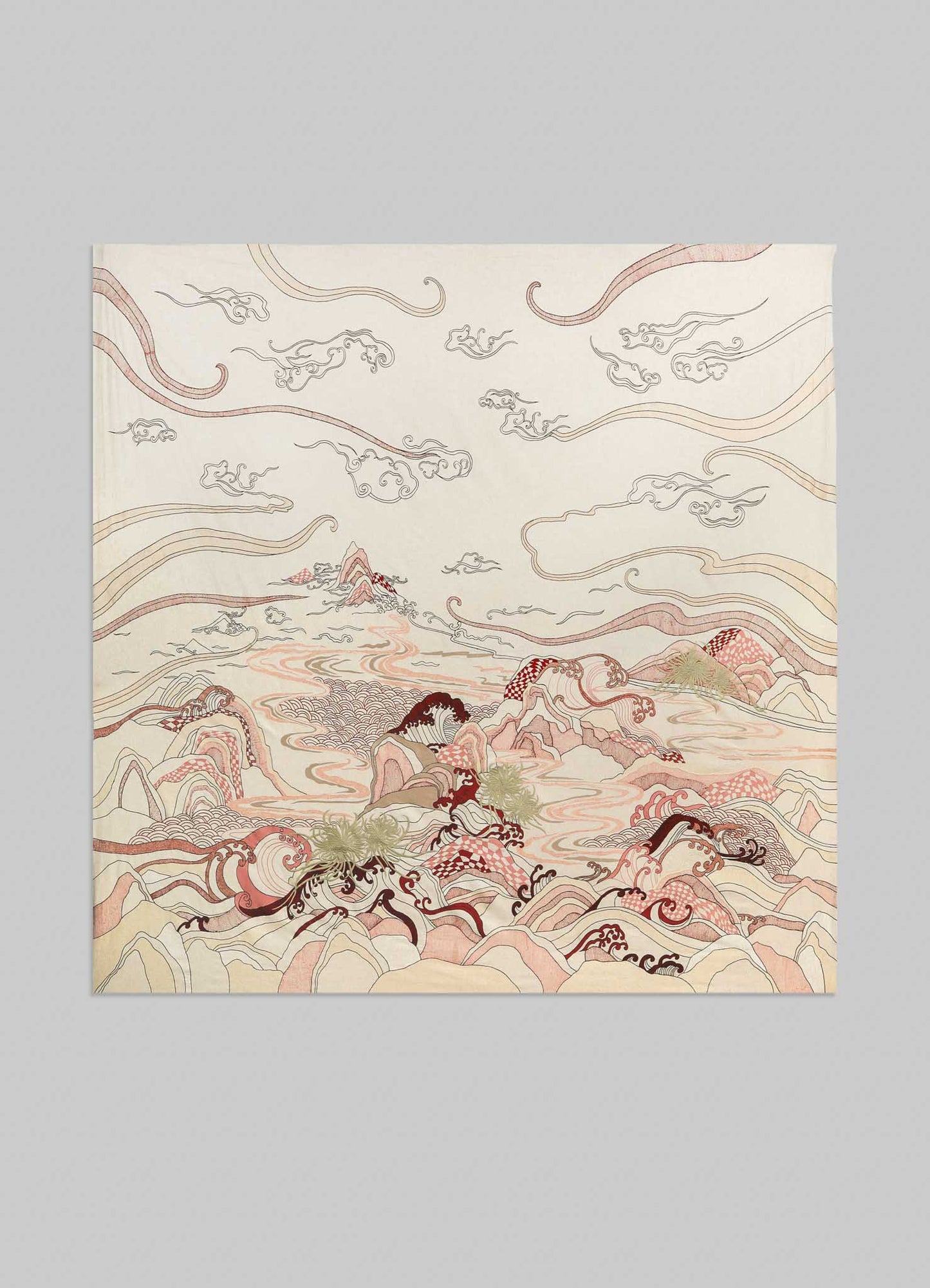 The Dreamscape Ecru Embroidered Bedcover by Viya showcases delicate, stylized mountains and clouds in beige, red, and brown tones with flowing lines on a light background, evoking Rajput manuscript-inspired motifs.