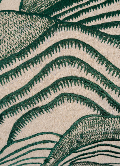 Close-up of the Viya Dreamscape Green Embroidered Mounds Cushion Cover (12"x18"), featuring textured green thread embroidery in wavy, abstract patterns on a beige base for an artistic, textile-inspired look.