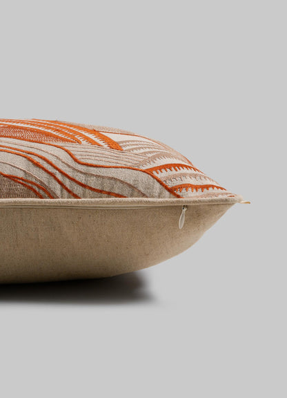 The Viya Dreamscape Orange Embroidered Mounds Cushion Cover (12"x18") features a beige base with orange geometric motif embroidery and a visible zipper, displayed side view on a plain gray background.
