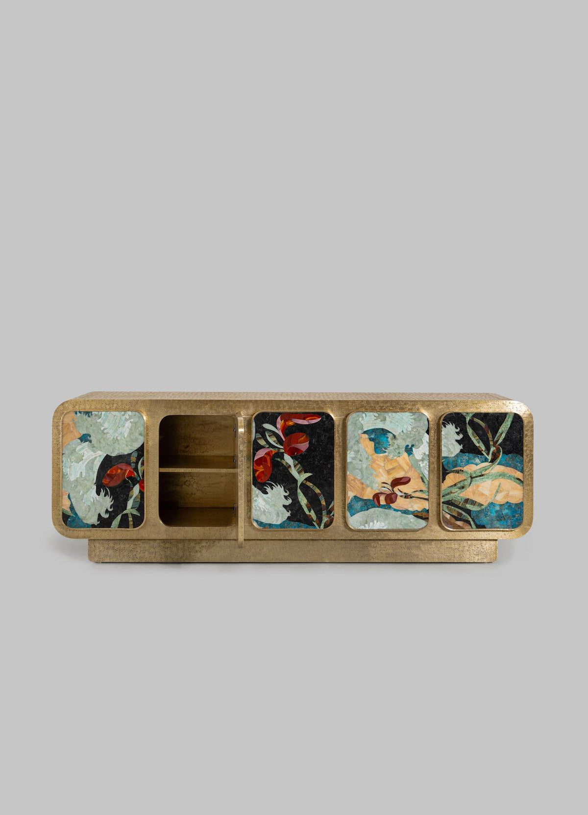 The VIYA Gardens Of India Cabinet is a rectangular wooden sideboard with four cabinet doors, each adorned with vibrant floral and bird designs on a light gray background. Two open shelves are on the left side, inspired by Indian garden art.