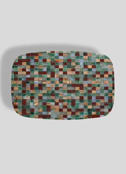 The VIYA Mosaic Side Table B features a rectangular design with rounded edges and a mosaic of small green, red, brown, and cream squares, reminiscent of classic mosaic tables, shown against a plain light gray background.
