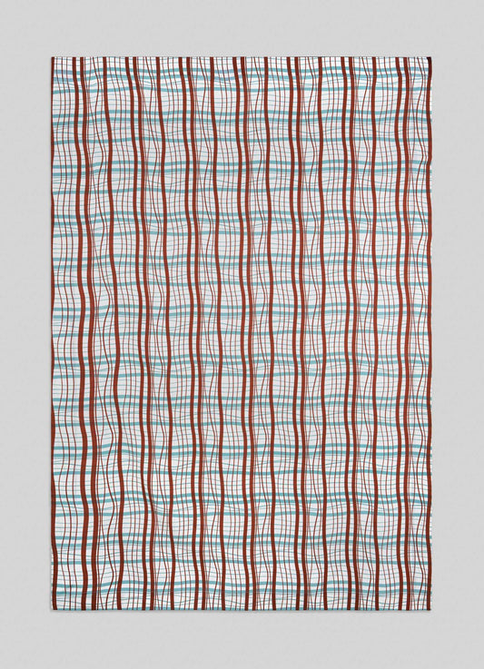 The Madras Check Aqua & Rust Table Cloth by Viya features vertical wavy red lines and straight blue, pink, and green lines forming a grid on white, offering a modern take inspired by traditional Indian Madras checks.