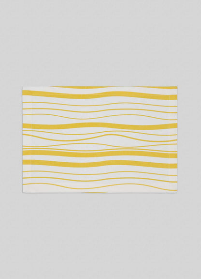 The Viya Madras Check Yellow Placemats (Set of 4) feature a white background with evenly spaced yellow wavy lines, blending contemporary style with traditional Indian textile design.
