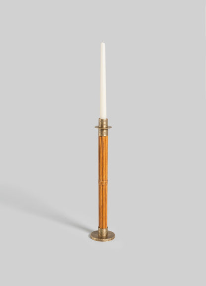 The VIYA Namsai Candle Holder Large features a tall, slender wooden body with brass accents and holds a white taper candle, displayed against a plain light gray background.
