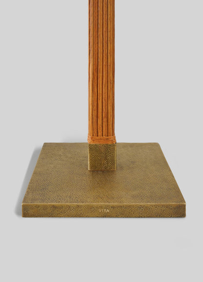 The VIYA Namsai Floor Lamp Square features a textured brass base with elegant trimmings, supporting a vertical brown pole wrapped with cord near the bottom, set against a light gray background.