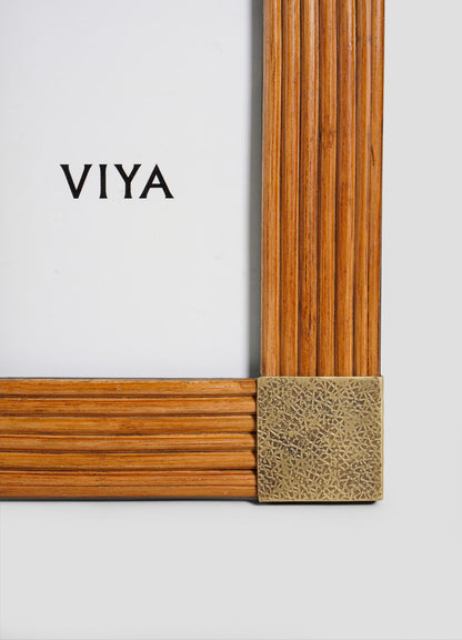 The VIYA Namsai Photo Frame Large features vertical and horizontal grooves, a decorative brass corner, and "VIYA" centered on a white background, inspired by handcrafted frames from the Namsai collection.