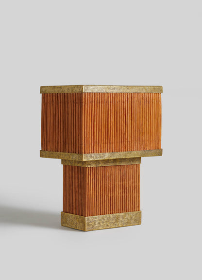The VIYA Namsai Table Lamp Large features vertical orange-brown ribbed panels and elegant brass trimmings on a modern square base, shown against a plain light gray background.