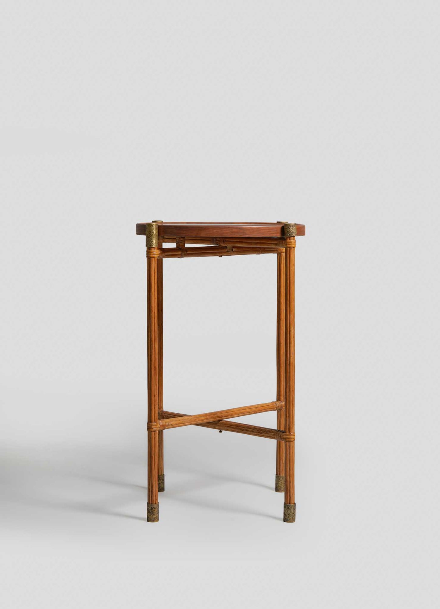 The VIYA Namsai Tray Table Large is a tall, narrow wooden side table with four straight legs, brass accents at the corners and feet, and a crossbar support near the base, shown against a plain light background.