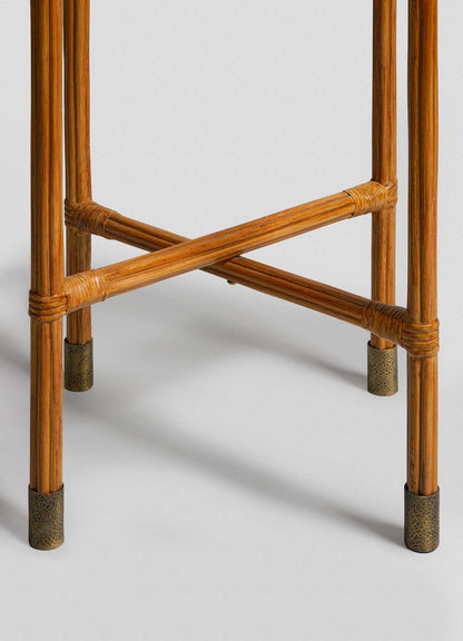 Close-up of the legs of the VIYA Namsai Tray Table Tall, featuring a crossed support structure and elegant brass trimmings at the bottom of each wooden leg.