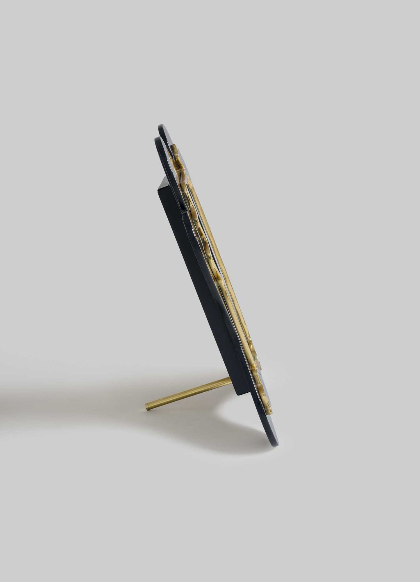 The VIYA Nazar Black Photo Frame features a black back, gold support stand, and metal clips—perfect for displaying cherished photos or a protective evil eye Nazar amulet.