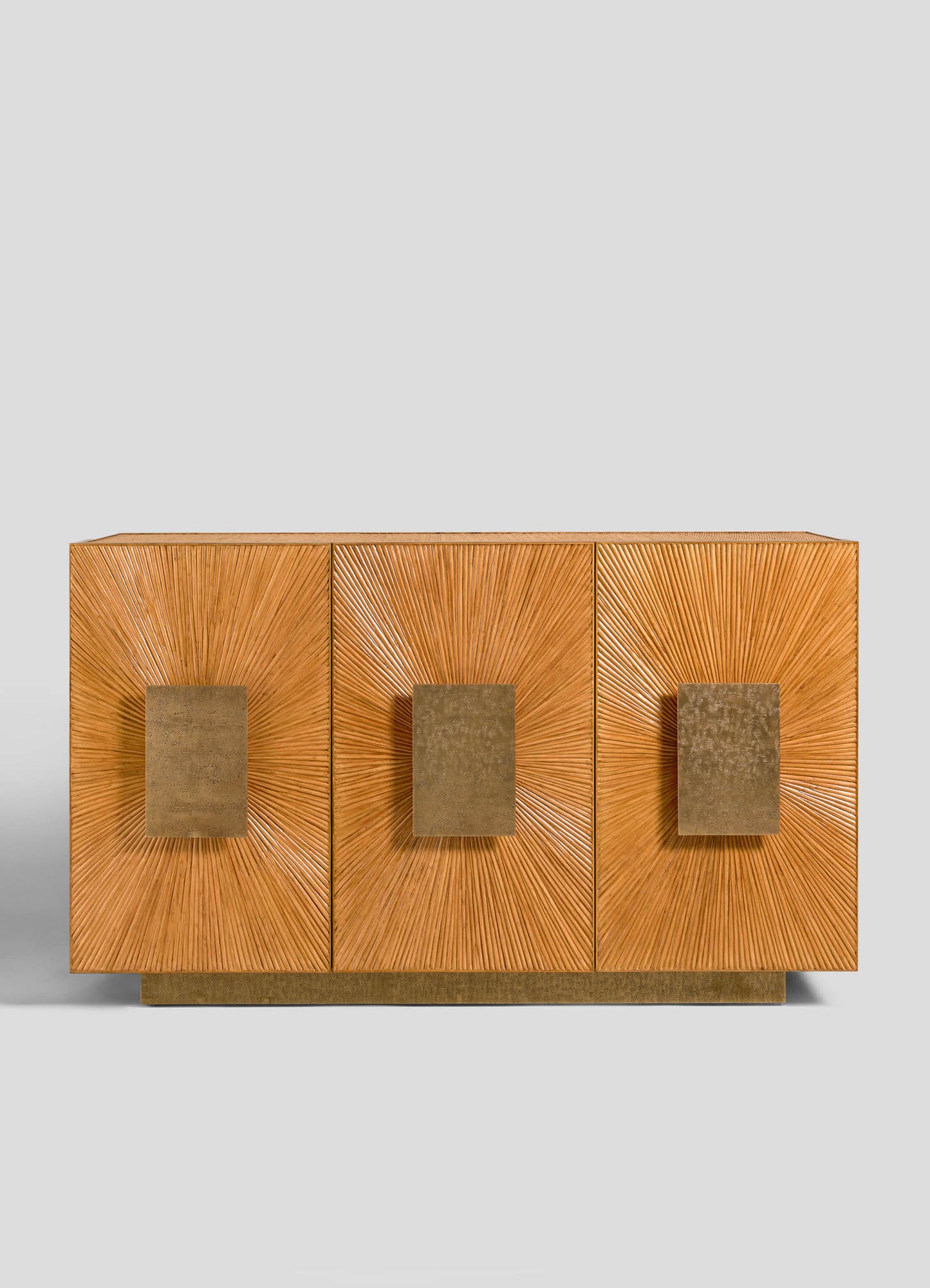 The VIYA Namsai Cabinet is a modern sideboard with three square cabinets featuring gold sunburst designs and textured brass handles, a clean geometric look, and a metallic gold base.