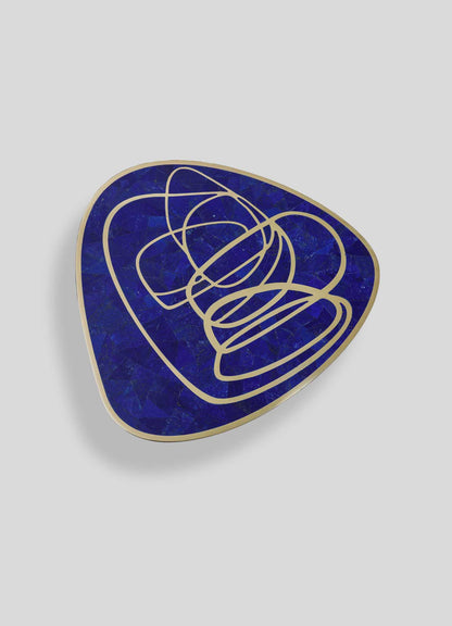 Luxury blue lapiz lazuli side table with gold abstract swirl design, modern sculptural accent furniture for contemporary living room or office decor.