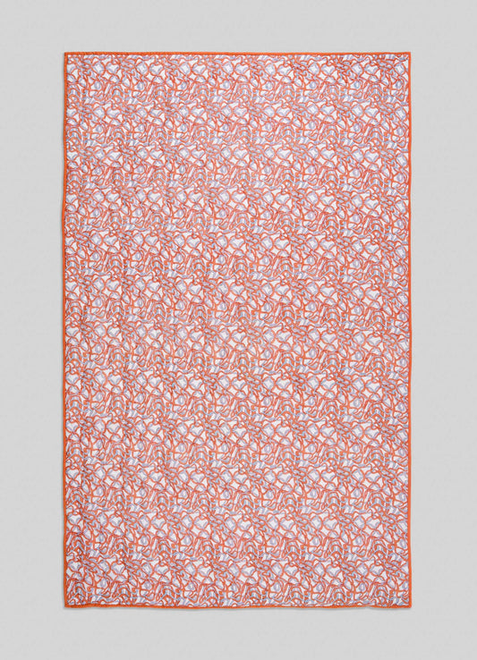 The Viya Paigah Orange & Blue Single Quilt is a rectangular fabric displaying intricate orange and blue Indo-Islamic abstract patterns with a solid orange border, shown against a light gray background.