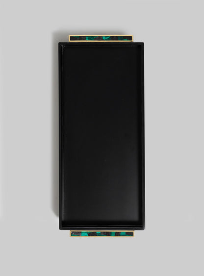 The VIYA Rivoli Black Vanity Tray features a rectangular black design with gold and green marble-patterned handles on opposite sides, evoking Art Deco elegance. Displayed against a plain light gray background.