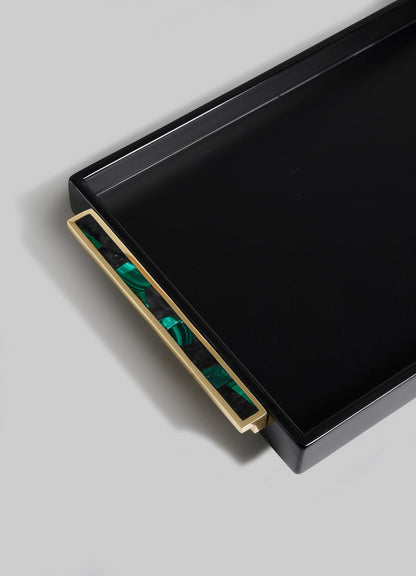 The VIYA Rivoli Black Vanity Tray features a rectangular design with a gold handle and a green and black marbled pattern, inspired by Art Deco-era Bombay, displayed against a light gray background.