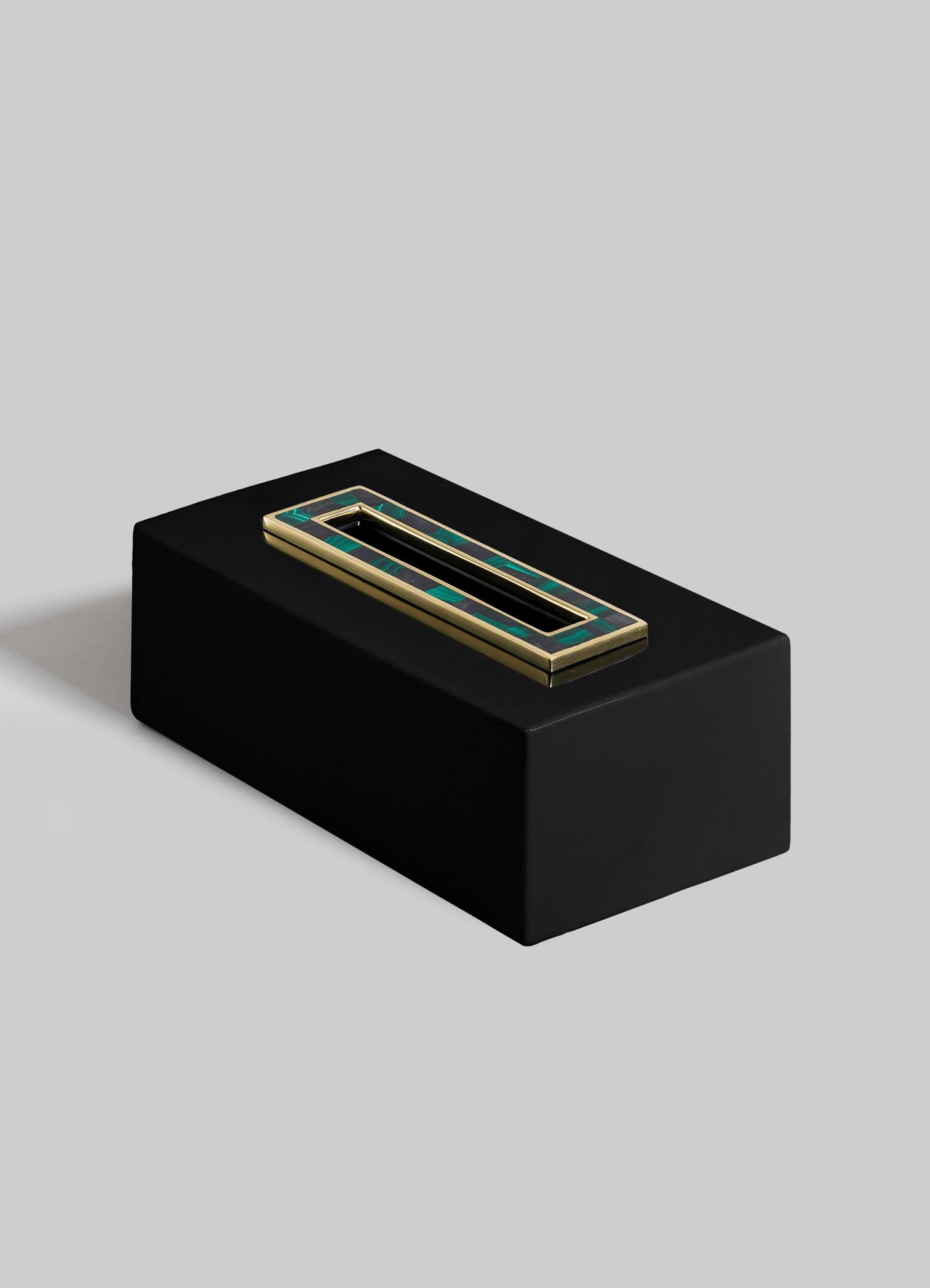 The VIYA Rivoli Tissue Box features a black rectangular design with gold and green Art Deco-inspired outlines on top, evoking classic Bombay cinema halls, set against a light gray background.