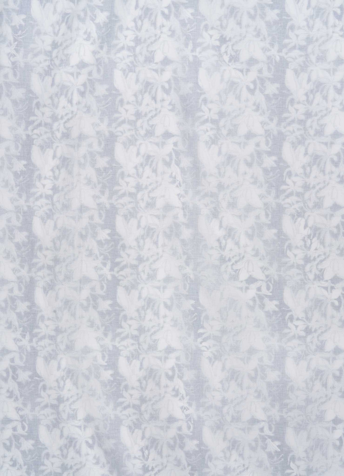 The Viya Spring Bouquet Blue Single Dohar features a delicate, translucent fabric with a vertical floral pattern of detailed leaves and flowers, evoking the elegance and texture of Indian garden bedding.