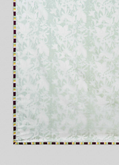 The Viya Spring Bouquet Green King Size Dohar features a light, semi-transparent white fabric with a subtle floral pattern inspired by Indian garden bedding and a border of alternating yellow, maroon, and white rectangular blocks.