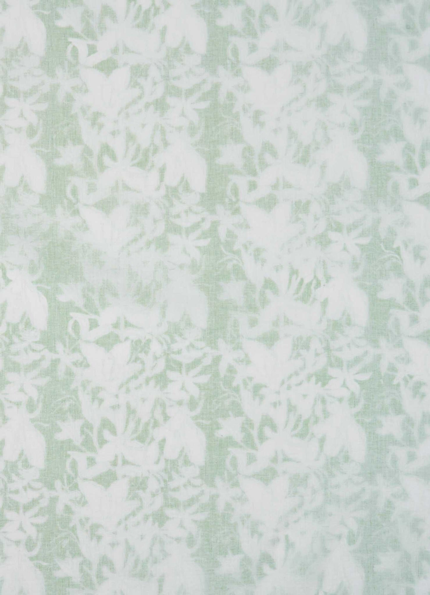 The Viya Spring Bouquet Green King Size Dohar features pale green fabric with a delicate white floral pattern, evoking the elegance of Indian garden bedding and offering a soft, lace-like look.
