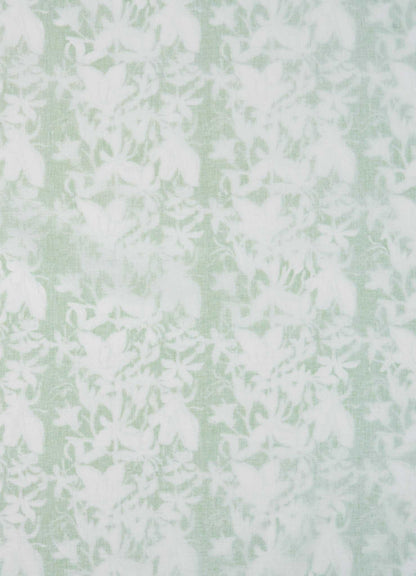 The Viya Spring Bouquet Green King Size Dohar features pale green fabric with a delicate white floral pattern, evoking the elegance of Indian garden bedding and offering a soft, lace-like look.